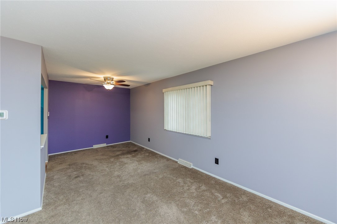 6472 State Road, Unit J19 Parma, OH 44134 - Photo 9 of 33 Carpeted empty room featuring ceiling fan
