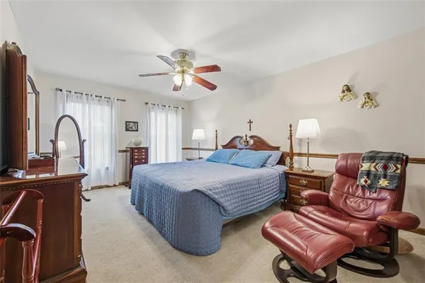 a bedroom with furniture and wooden floor