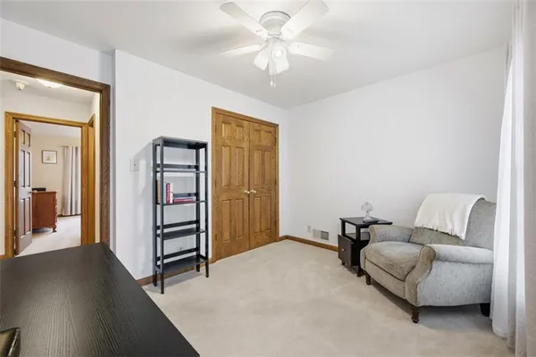 a living room with furniture and a dining table