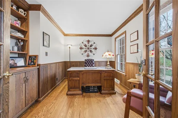 a living room with furniture a rug and a window
