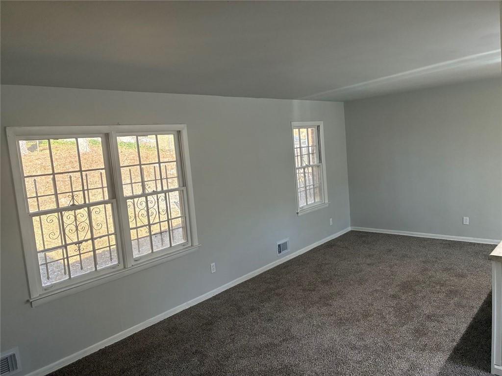 3992 Maplewood Drive Decatur, GA 30035 - Photo 11 of 44 an empty room with windows