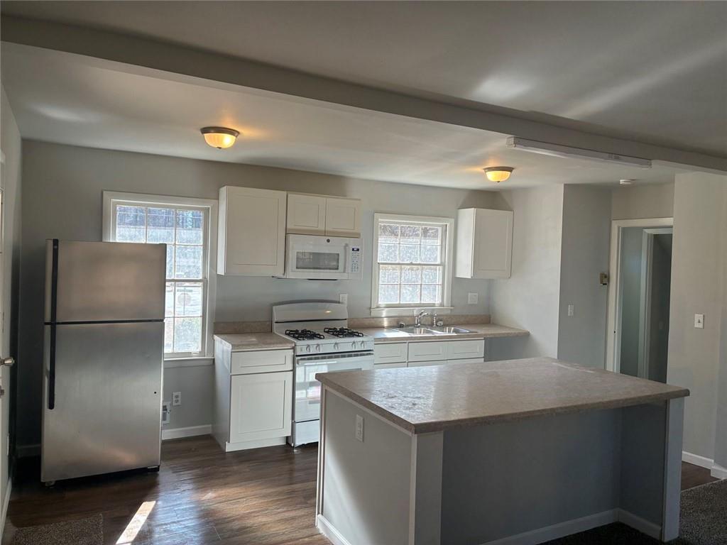 3992 Maplewood Drive Decatur, GA 30035 - Photo 18 of 44 a kitchen with a stove a refrigerator and a sink