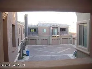a spacious bathroom with a tub sink and mirror