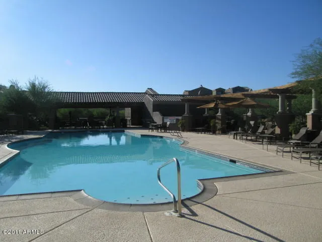 a wooden bench sitting in front of a building