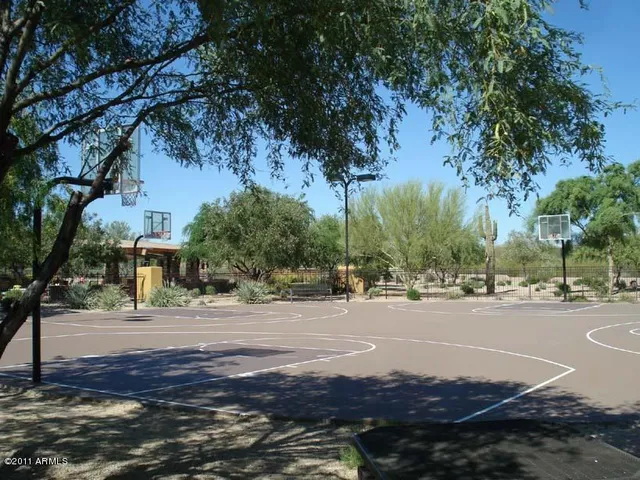 a wooden bench sitting in front of a building