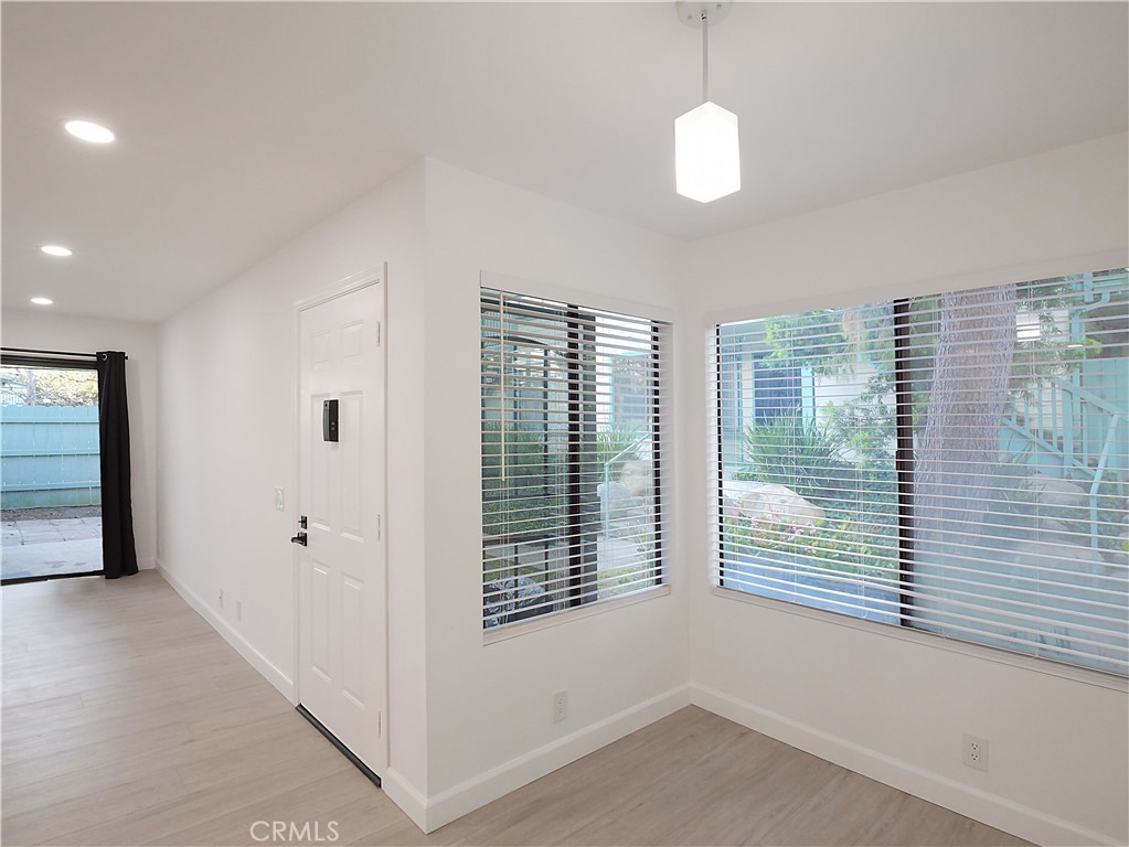 20561 South Vermont Avenue, Unit 7 Torrance, CA 90502 - Photo 5 of 24 Front door with dining area and living space