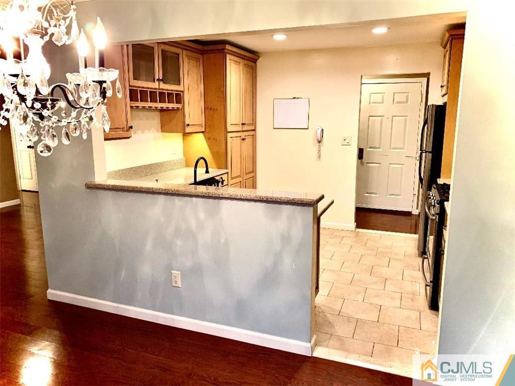 14 Kensington Road, Unit G Chatham, NJ 07928 - Photo 3 of 10 a view of a living room with a wooden floor