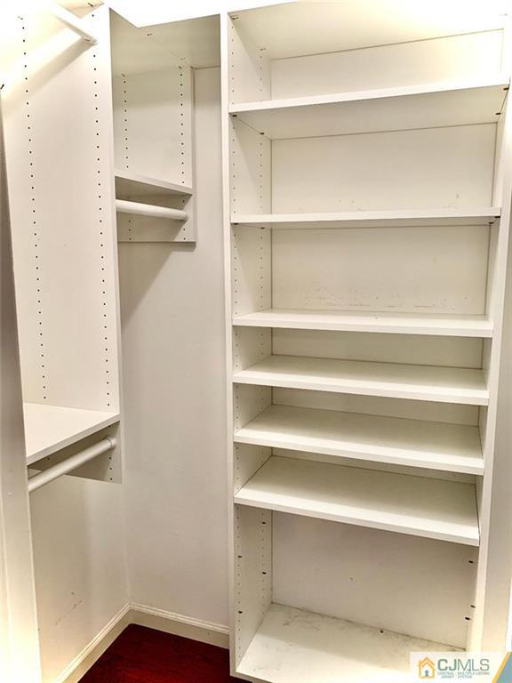 14 Kensington Road, Unit G Chatham, NJ 07928 - Photo 9 of 10 a view of walk in closet with empty racks
