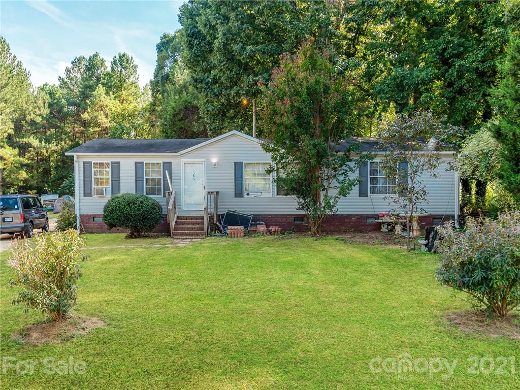 785 Thompson Road Salisbury, NC 28147 - Photo 1 of 23 a view of a house with backyard and garden