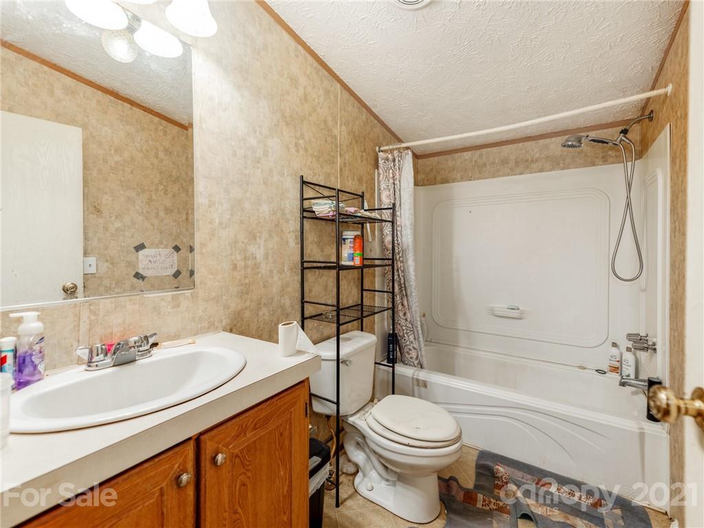 785 Thompson Road Salisbury, NC 28147 - Photo 12 of 23 a bathroom with a sink toilet and shower