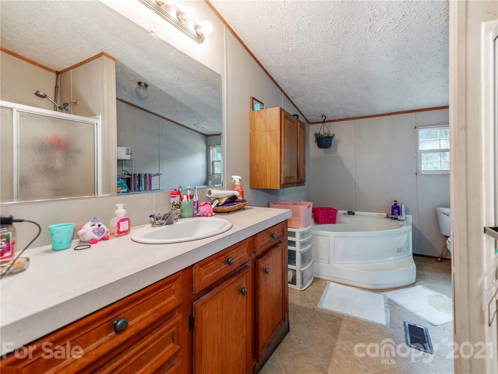 785 Thompson Road Salisbury, NC 28147 - Photo 15 of 23 a bathroom with a sink mirror vanity and toilet