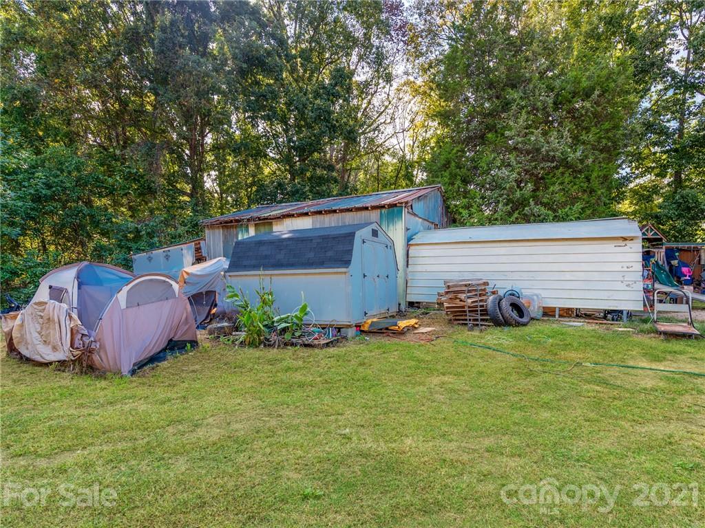 785 Thompson Road Salisbury, NC 28147 - Photo 20 of 23 a view of a backyard with potted plants and large tree