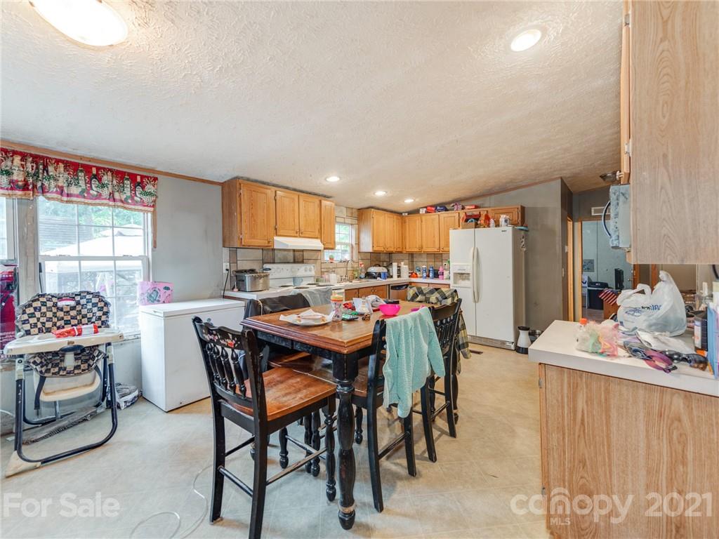785 Thompson Road Salisbury, NC 28147 - Photo 6 of 23 a dining room with a table and chairs