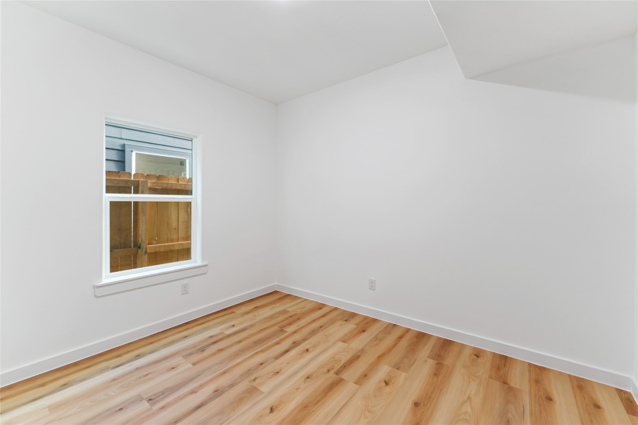 9326 Firnat Street Houston, TX 77016 - Photo 14 of 30 an empty room with a window