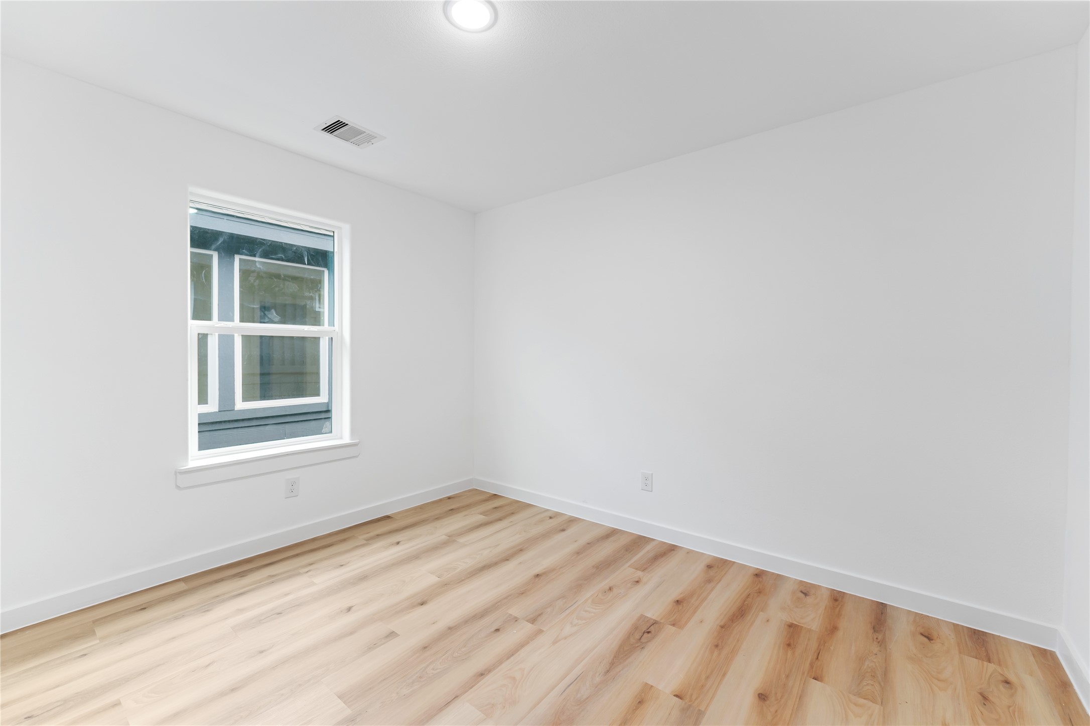 9326 Firnat Street Houston, TX 77016 - Photo 23 of 30 an empty room with a window