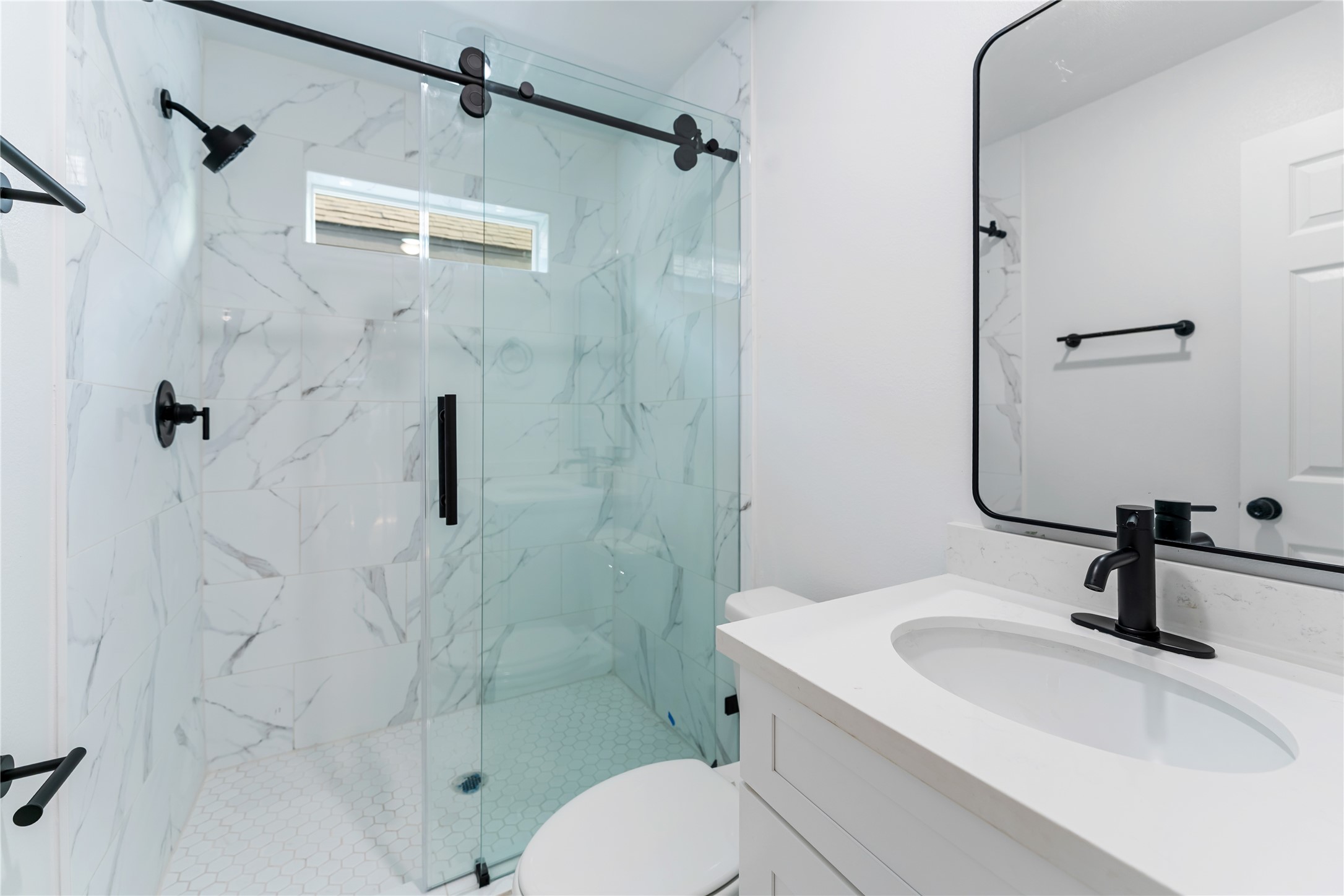 9326 Firnat Street Houston, TX 77016 - Photo 25 of 30 a bathroom with a sink toilet and shower