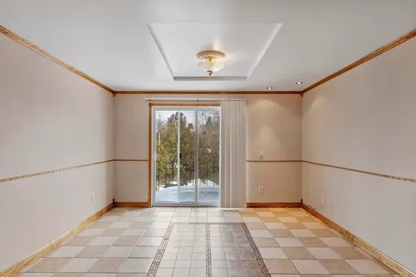 a view of a kitchen with a sink and a refrigerator