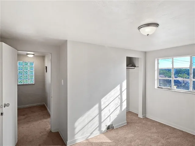 a view of a hallway with windows