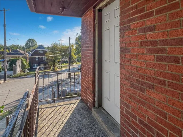 a view of a balcony with an outdoor space