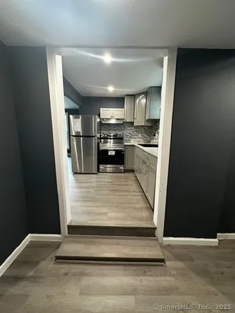a view of kitchen with sink and microwave