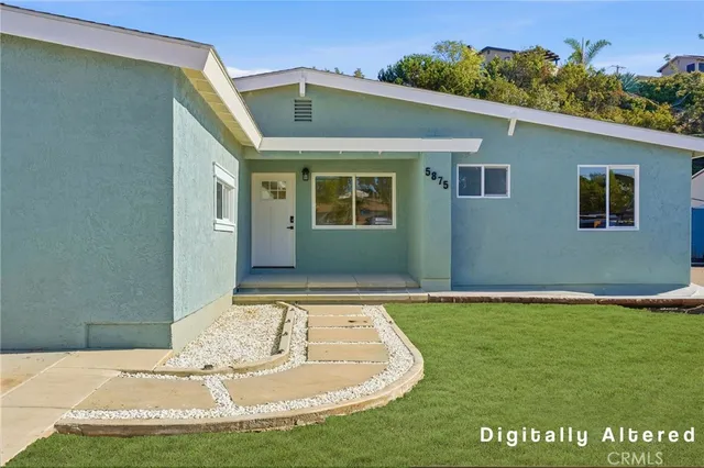 a view of a house with a yard