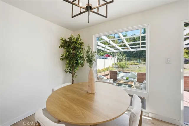 a dining room with table and chairs