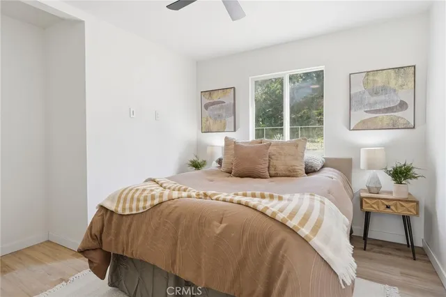 a bedroom with a bed and window