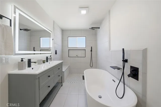 a bathroom with a granite countertop sink a toilet and mirror