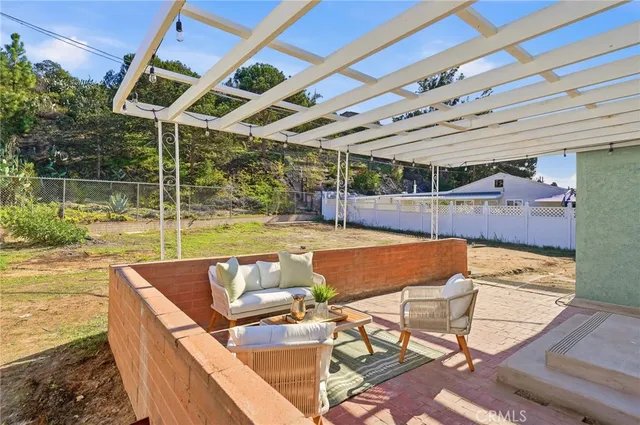 a view of a swimming pool with a patio