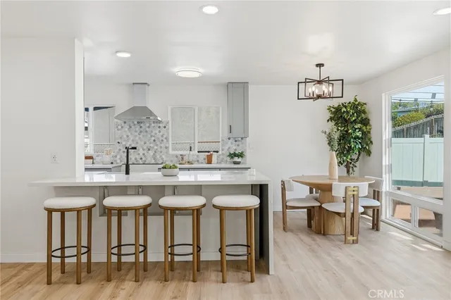 a kitchen with a table and chairs in it