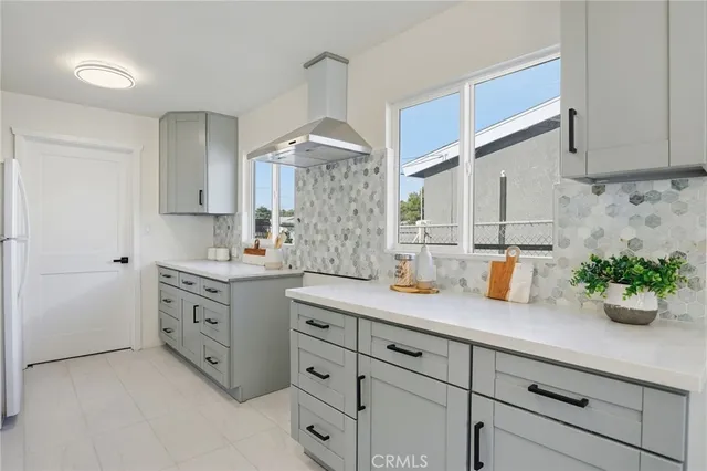 a kitchen with sink and cabinets