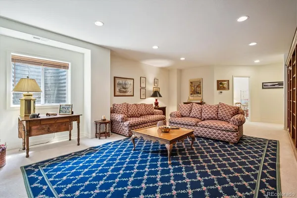 a living room with furniture and a rug