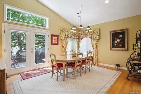 a view of a dining area with furniture and wooden floor
