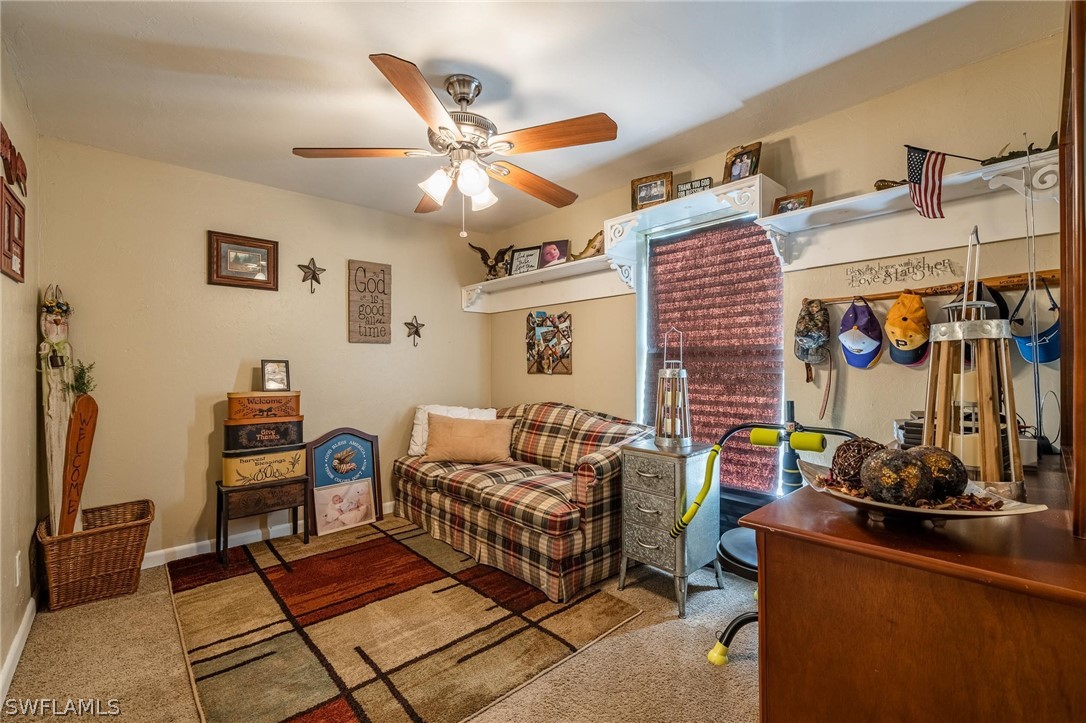 2313 Hamilton Avenue Alva, FL 33920 - Photo 19 of 30 a living room with furniture and a flat screen tv