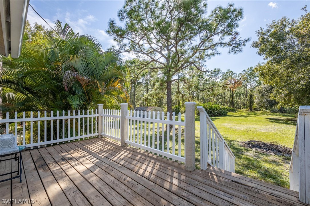 2313 Hamilton Avenue Alva, FL 33920 - Photo 22 of 30 a view of a balcony with wooden floor and fence