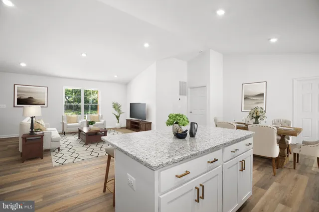 a living room with granite countertop furniture and fireplace