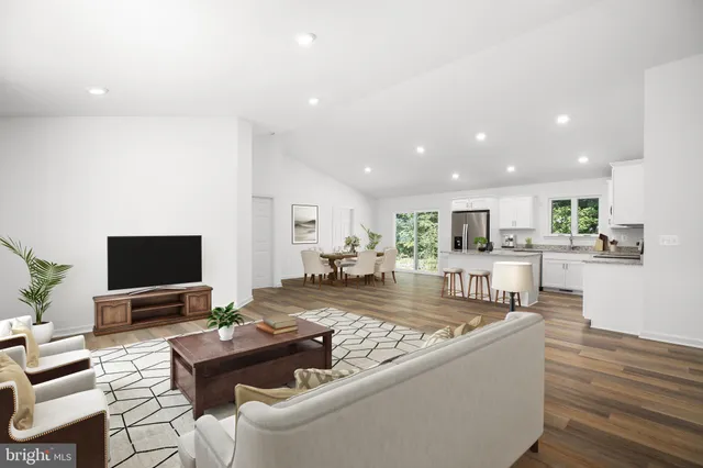 a living room with fireplace furniture and a flat screen tv