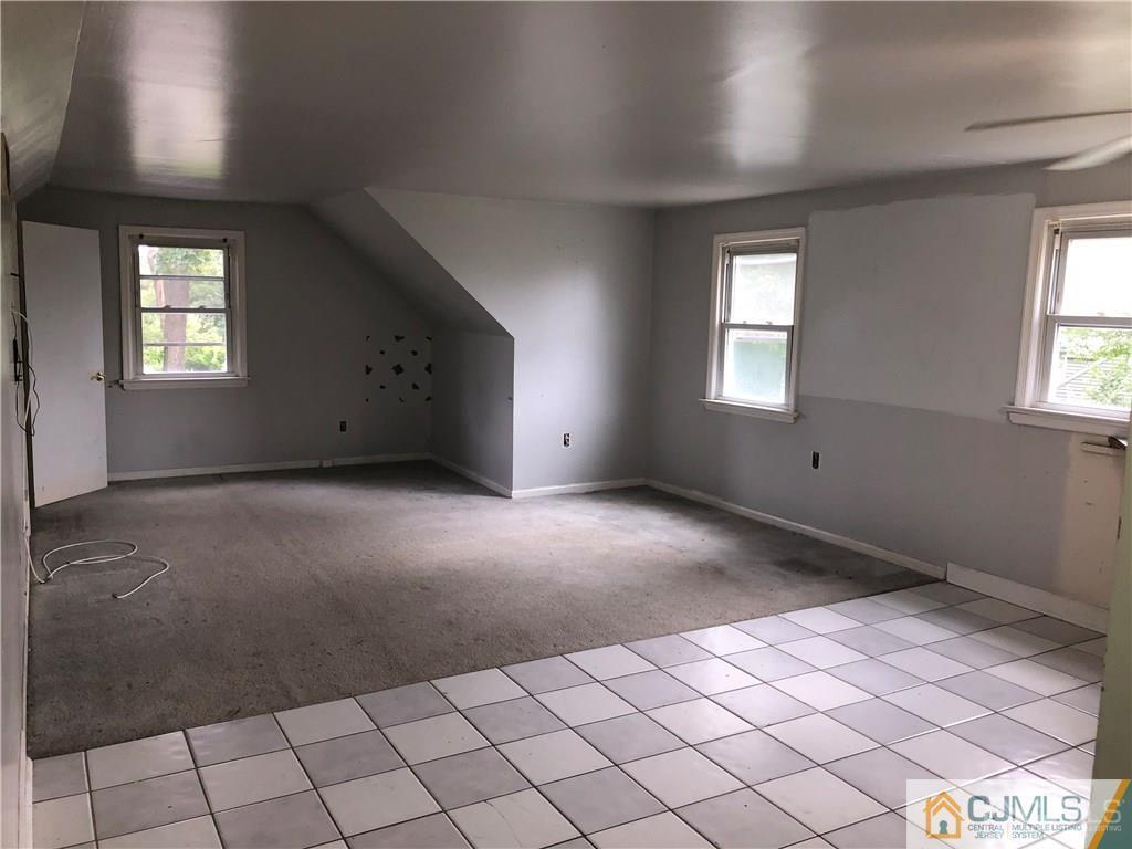 182 Prospect Plains Road Monroe Township, NJ 08831 - Photo 17 of 22 an empty room with windows