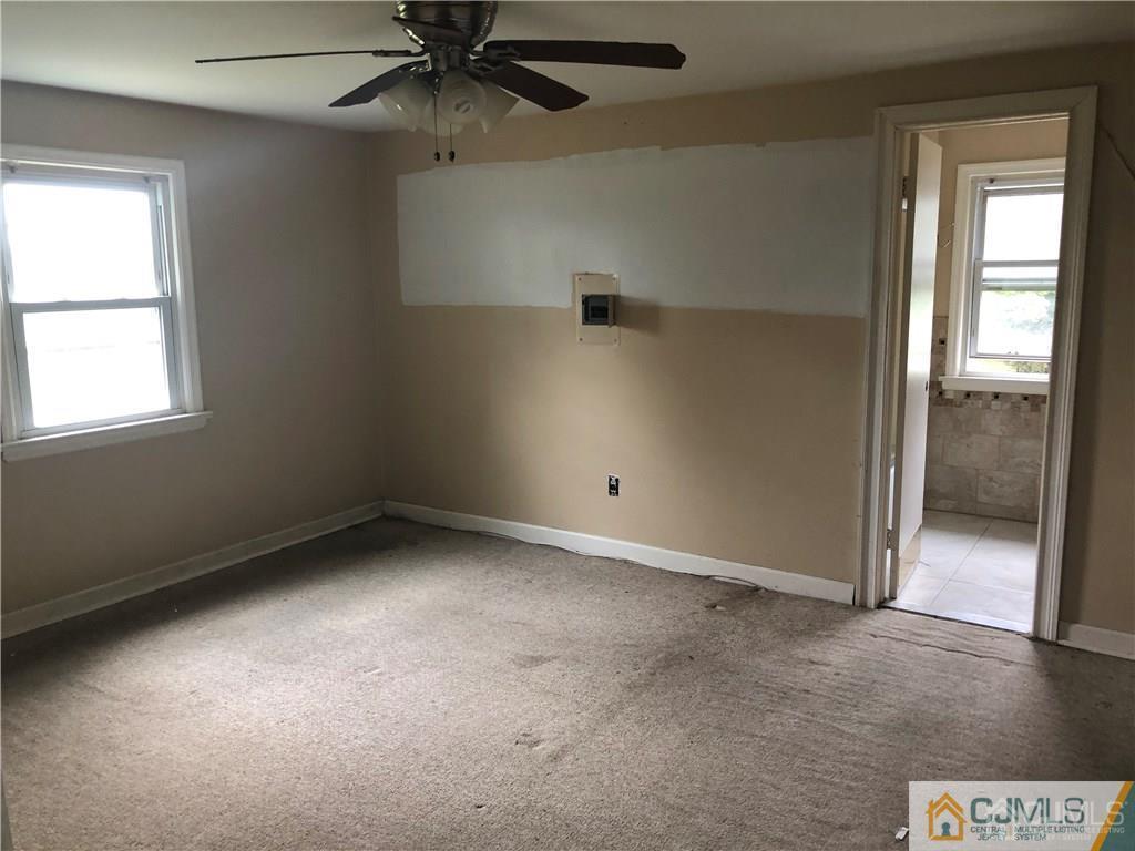 182 Prospect Plains Road Monroe Township, NJ 08831 - Photo 19 of 22 an empty room with a window