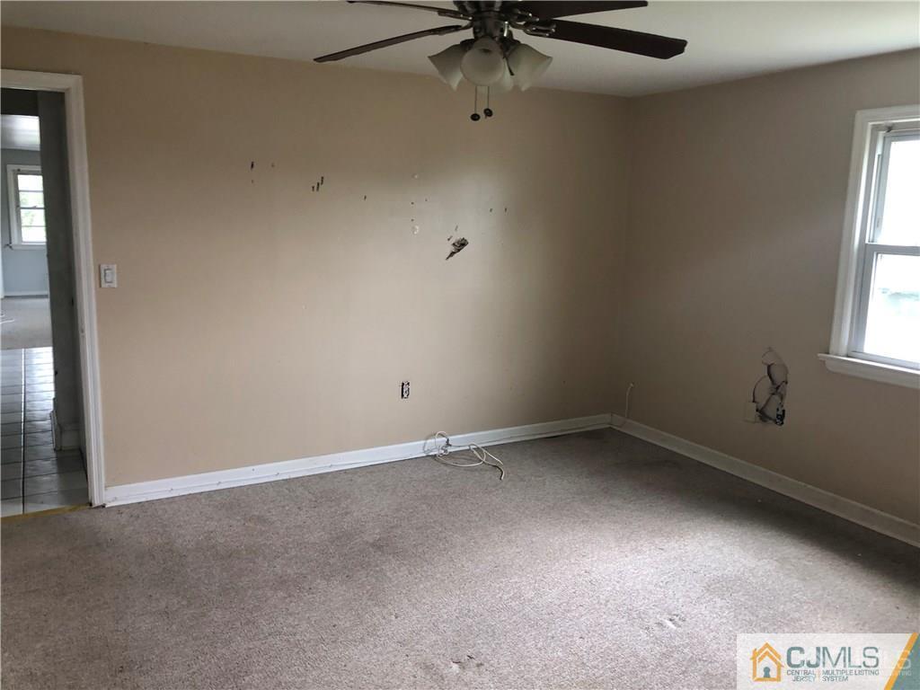 182 Prospect Plains Road Monroe Township, NJ 08831 - Photo 21 of 22 an empty room with a window