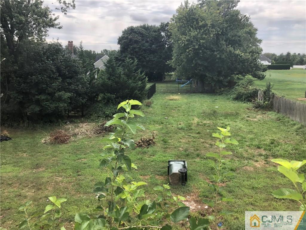 182 Prospect Plains Road Monroe Township, NJ 08831 - Photo 22 of 22 a backyard of a house with lots of green space