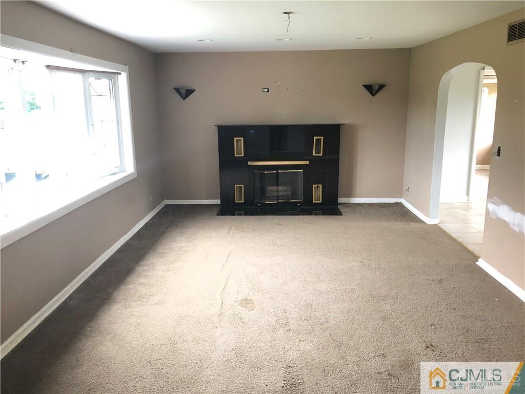 182 Prospect Plains Road Monroe Township, NJ 08831 - Photo 4 of 22 a view of an empty room with a window