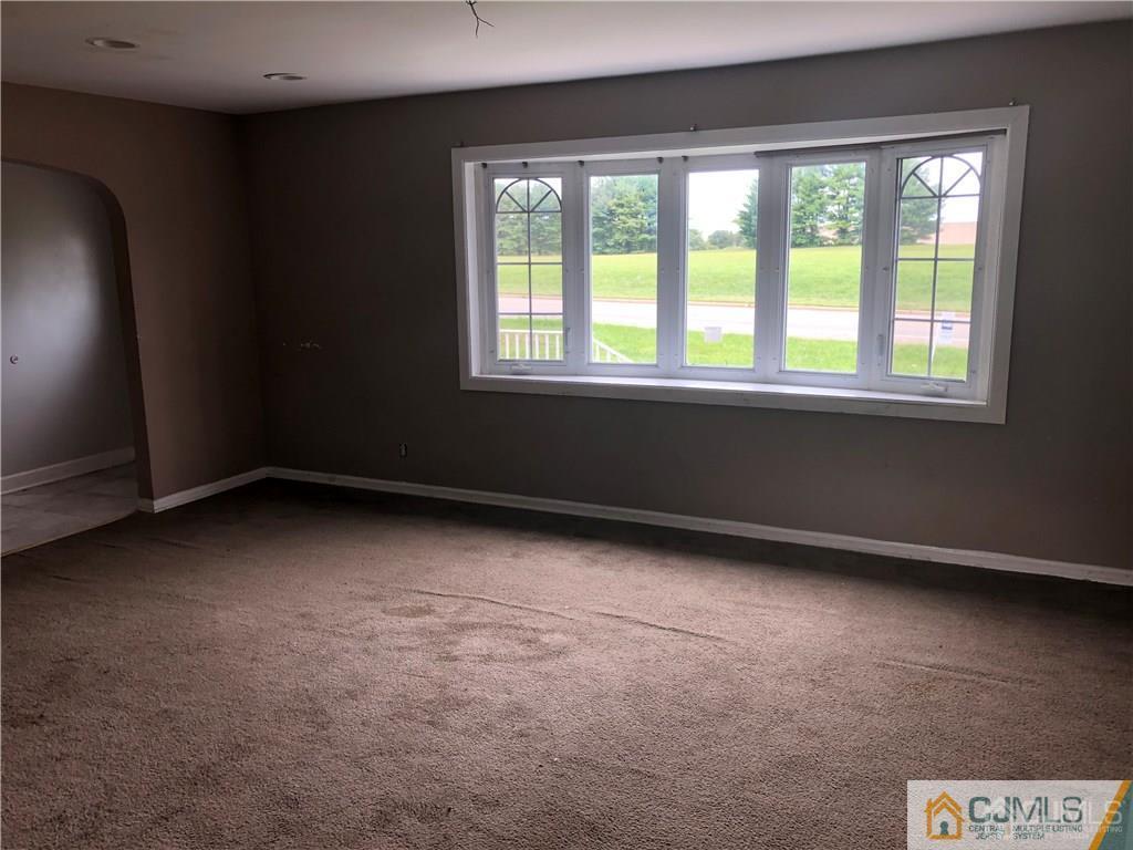 182 Prospect Plains Road Monroe Township, NJ 08831 - Photo 5 of 22 an empty room with a window