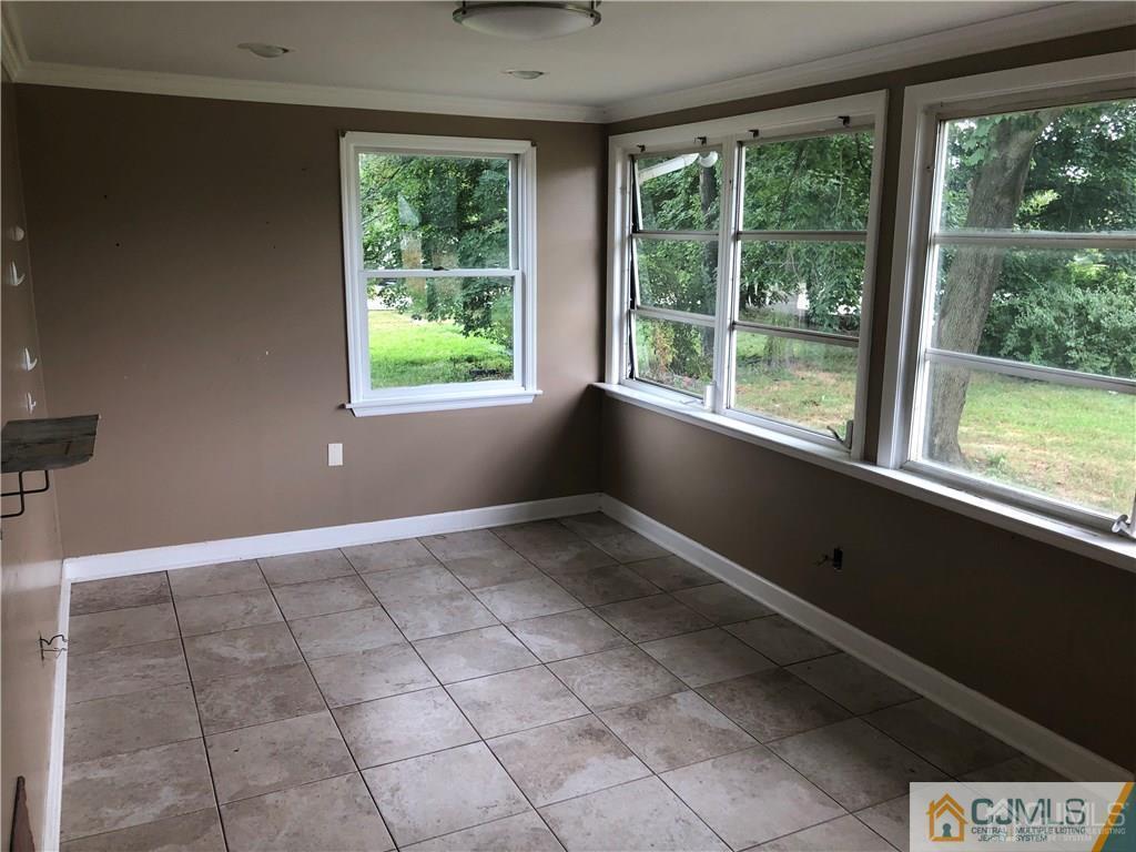 182 Prospect Plains Road Monroe Township, NJ 08831 - Photo 9 of 22 a view of an empty room with a window
