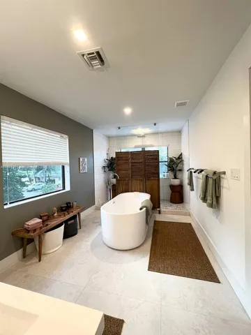 a view of a livingroom with wooden floor and cabinet
