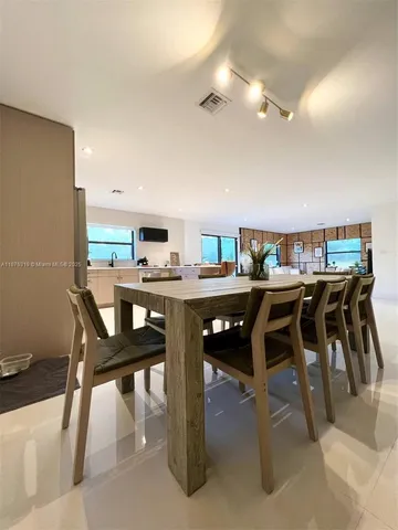 a bedroom with a bed and a potted plant