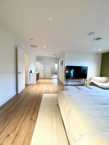 a bed room with a bed and a couch
