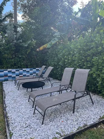 a view of a livingroom with furniture and a flat screen tv