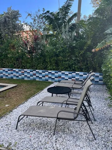 a close up of a close up of a black car parked in a kitchen