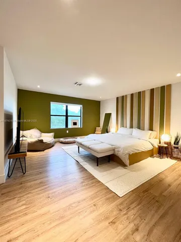 a view of a garden with lawn chairs